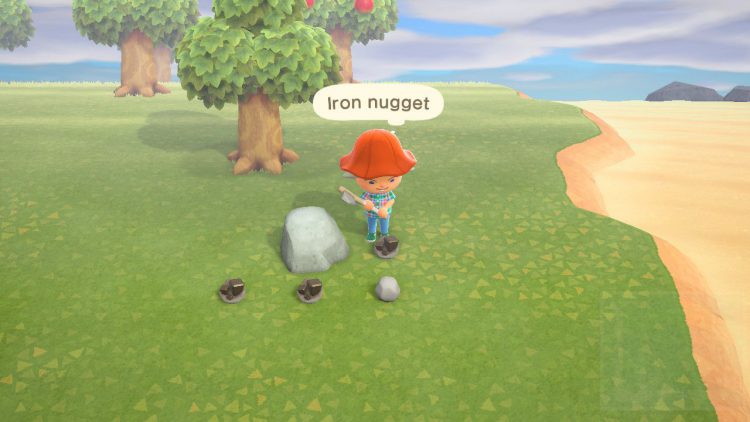 Iron Nuggets on the ground by a rock in Animal Crossing New Horizons.