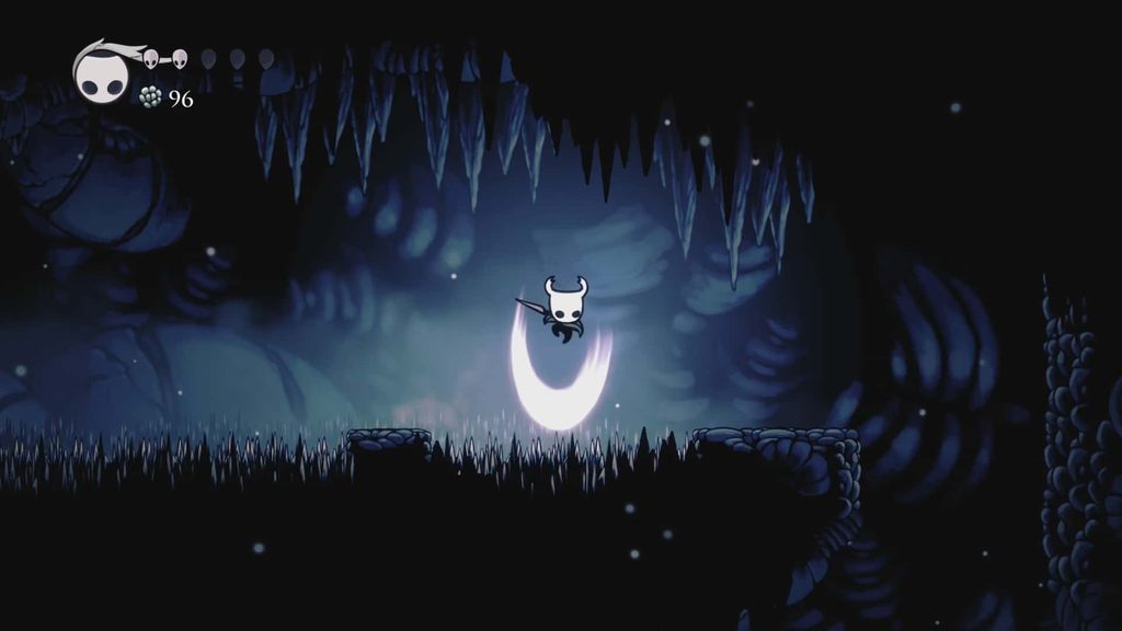 The Knight doing a Pogo Jump in Hollow Knight. 