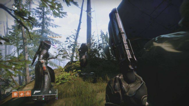 Xur standing on a cliffside next to a downed ship in the EDZ in Destiny 2.